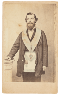 Studio portrait of Joshua Ardill, stonemason and grocer of nineteenth-century Parramatta wearing Mason's apro